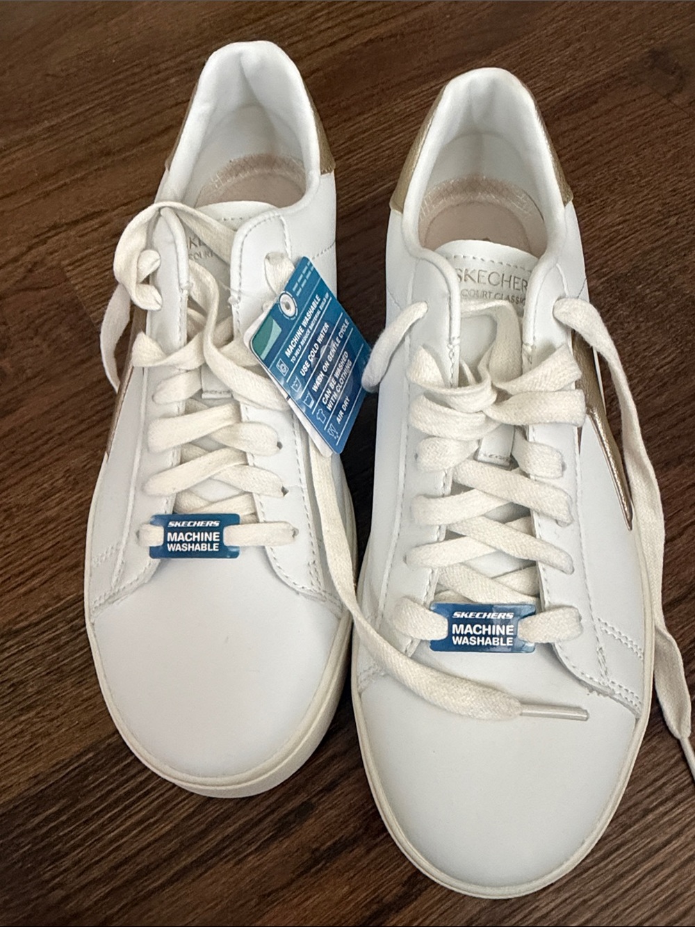 Skechers White Sneakers with Gold Heel Accent